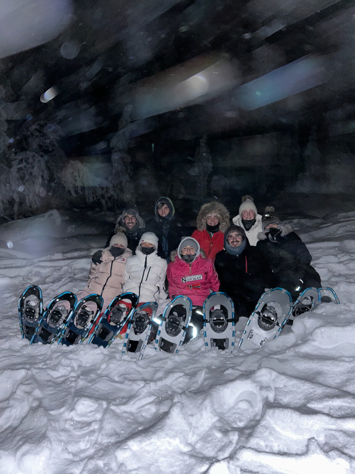 Night snowshoe hike with friends in Norway